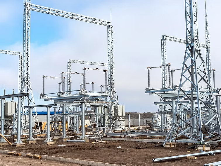 Galvanized substation steel structures against a blue sky